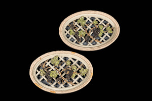 Two openworked polychrome wooden 'grapevines' medallions, 19/20th C.