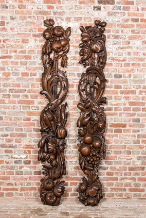 A pair of large carved oak reliefs with birds among fruit and flower scraps, 18th C.