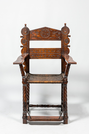 A walnut armchair with wicker upholstery, 19th C.