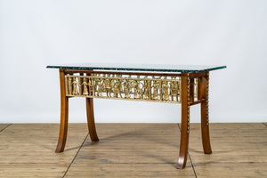 An Italian wooden table with gilt friezes after the antique with a thick glass top, 20th C.