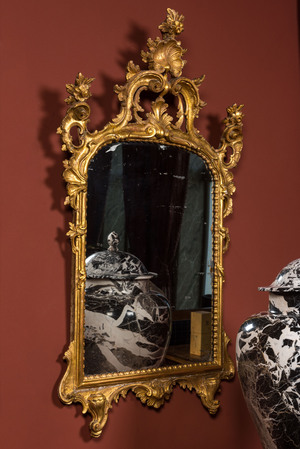 A French finely carved gilt wooden Louis XV-style rocaille mirror, 18/19th C.