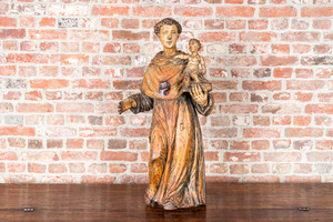 Saint Antoine en bois sculpté et polychromé tenant l'enfant Jésus, 17ème