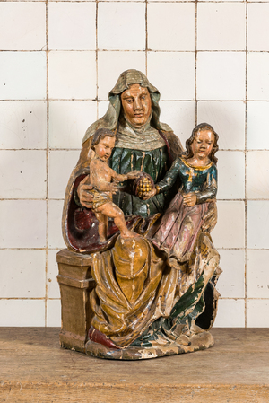 Een polychrome houten Sint-Anna-ten-drieën met granaatappel, 17e eeuw