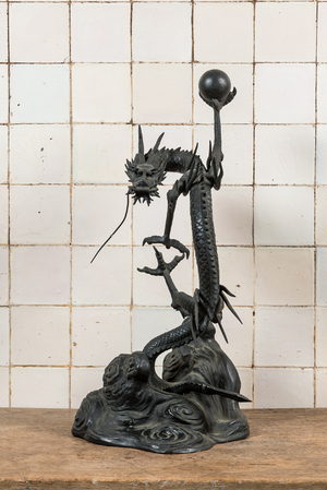 A large Japanese bronze okimono with a dragon holding the pearl of wisdom, Meiji, 19th C.