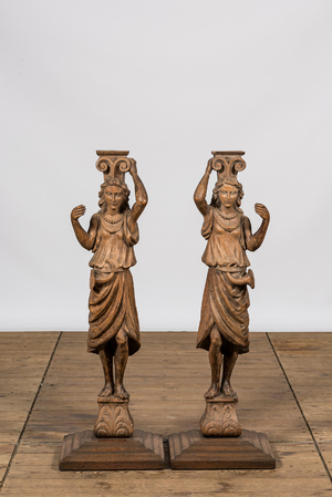 A pair of oak wooden caryatids on foot, 19th C.