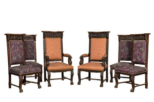 Een paar eikenhouten fauteuils en vier dito stoelen in historiserende stijl, 19/20e eeuw
