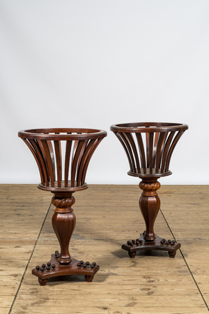 A pair of English Regency-style mahogany plant stands, 19th C.