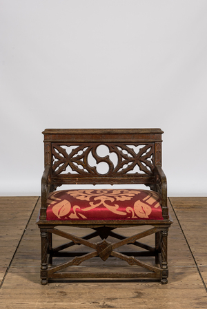 A Gothic Revival oak wooden church chair, 19th C.