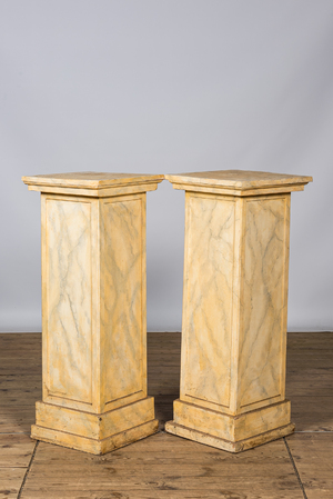 A pair of wooden 'faux marbre' pedestals, 20th C.