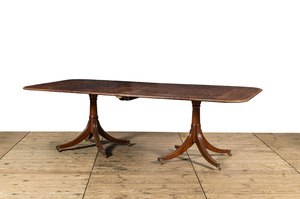 A large English mahogany dining table, 20th C.