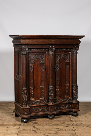 A Dutch oak two-door 'keeftkast' cupboard, 17th C. with later elements