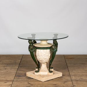 A bronze patinated metal and composite garden table with glass top, 20th C.