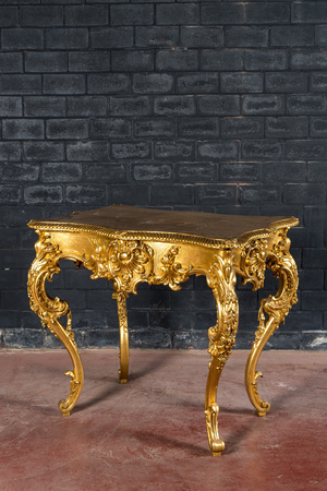 A lavish gilt Louis XV-style coiffeuse with rosewood veneer inside, 19th C.