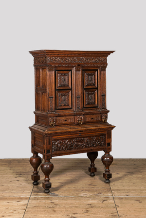 An oak and partly ebonised wooden cabinet on foot, 19th C. with older elements