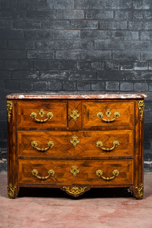 A French mahogany veneered gilt bronze mounted chest of drawers with marble top, 18th C.