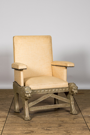 A gray patinated wooden armchair with lion heads, 20th C.