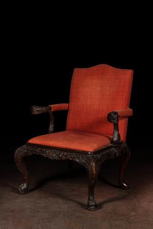 A richly decorated English Georgian style mahogany Gainsborough chair, ca. 1900