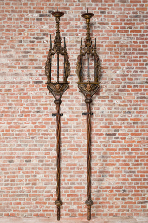 A pair of large polychromed and gilt processional torches with cherub heads, 18th C.